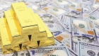 الذهب يرتفع والدولار يسجل أعلى مستوى في أسبوع